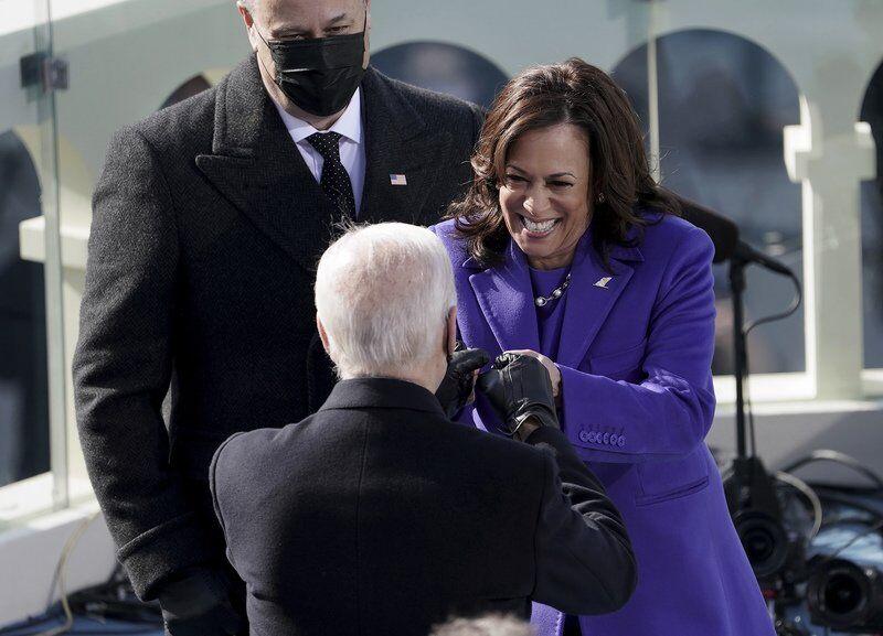 Vice President Kamala Harris bumps fists with President-elect Joe Biden after she was sworn in.